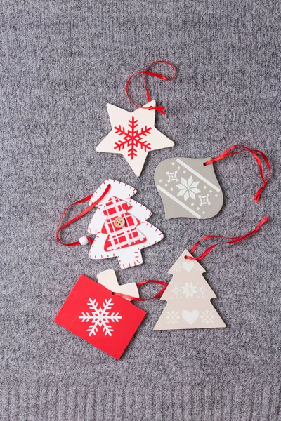 Christmas ornament flat lay on grey knitted plaid — Stock Photo, Image