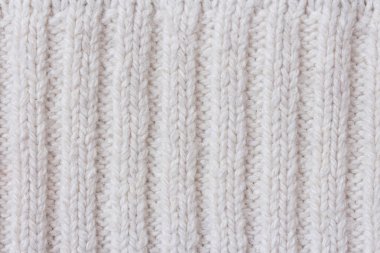 Sıcak beyaz örgü öğelere örgüler ve desen arka plan olarak