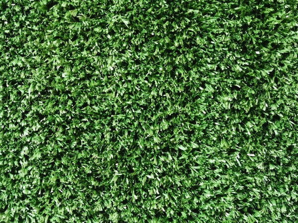 偽の緑の草のフィールドカーペットのためのスポーツ背景. — ストック写真