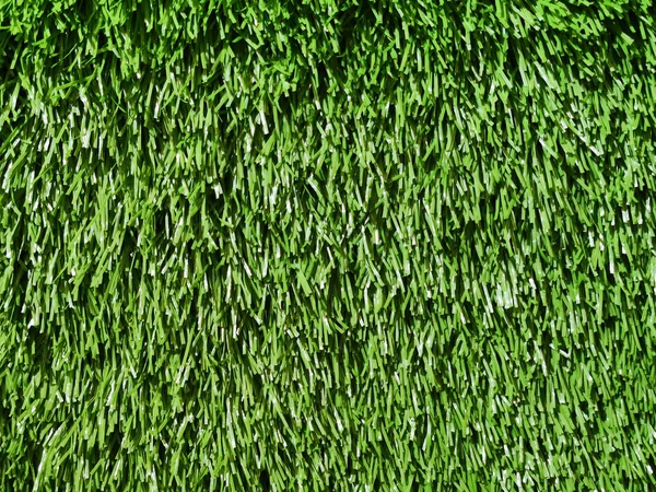 偽の緑の草のフィールドカーペットのためのスポーツ背景. — ストック写真