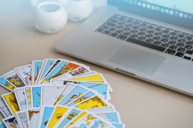 Blurred Online forecasting the future with tarot cards clipart
