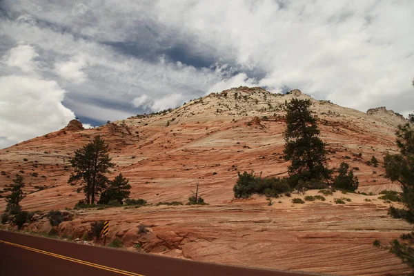 Orange rock hillside scenery along Zion-Mount Carmel Highway in Zion National Park, Utah