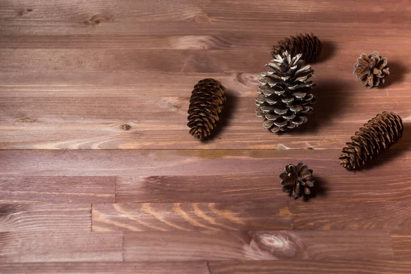 pine cones on wooden background. abstract composition. fir cones. Pine cones