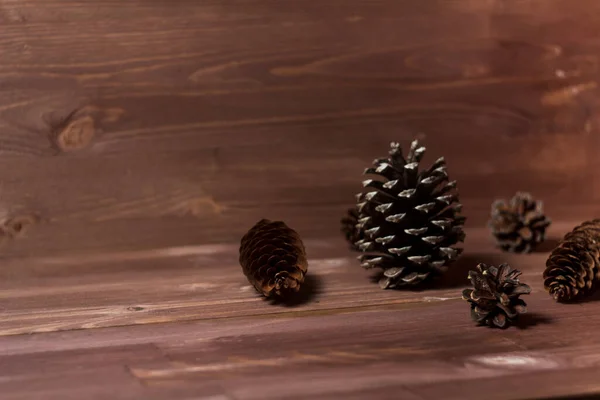 pine cones on wooden background. abstract composition. fir cones. Pine cones