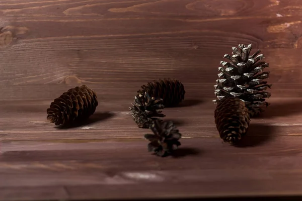 pine cones on wooden background. abstract composition. fir cones. Pine cones