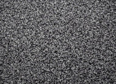 Odadaki siyah ve gri plastik masa örtüsü arka planının ve duvar kağıdının yakın çekimi. Siyah ve gri üretilmiş plastik masanın dokusu. Yüksek kaliteli makro fotoğrafçılık.