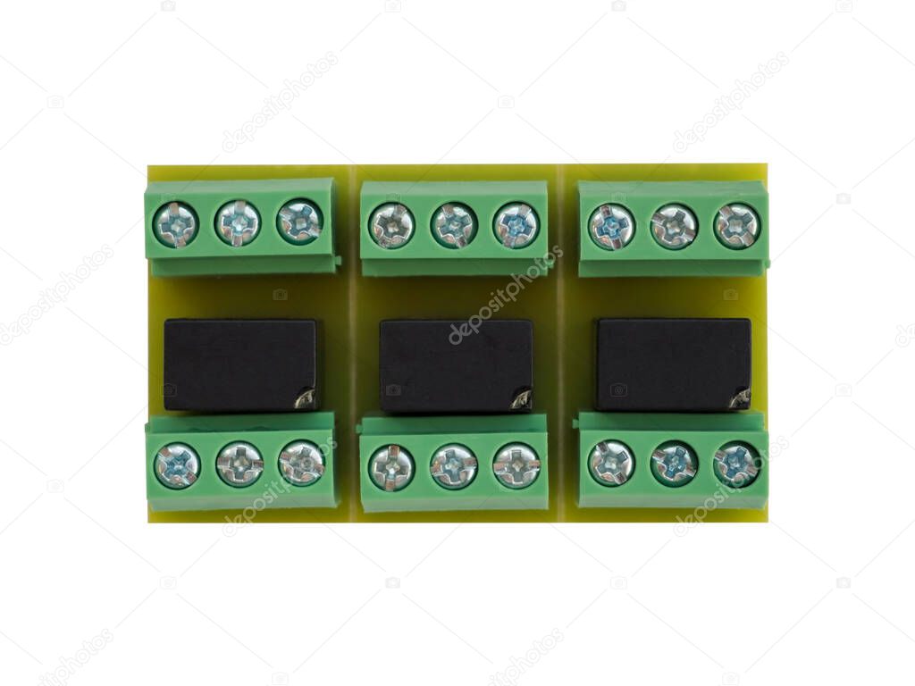 Close-up of expansion module of three relays with contacts on the PCB for wires connecting. Green and black colour. Isolated on white background. High-quality macro photography.