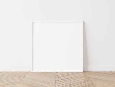 Beyaz ahşap çerçeve, ahşap zeminde kare poster