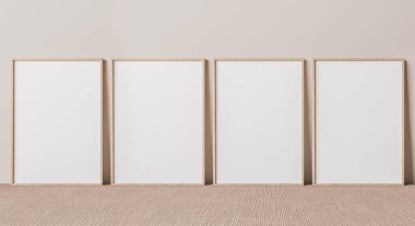 Boş dikey poster çerçevesi bej zeminde duruyor. İskandinav iç kısımlarında izole edilmiş dört ahşap çerçeve..