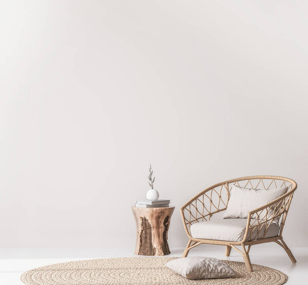 Mock up wall in Scandinavian living room design, home decor with rattan armchair and natural wooden table on empty bright background