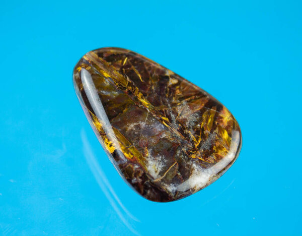 A pietersite with awesome golden glowing inclusions.