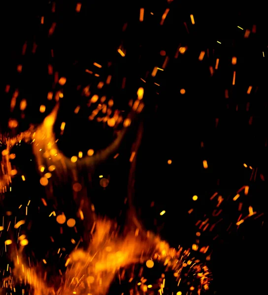 flame of fire with sparks on a black background