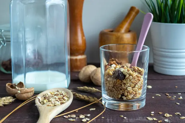 Useful muesli with milk in a glass on a wooden table. Healthy lifestyle — Stock Photo, Image