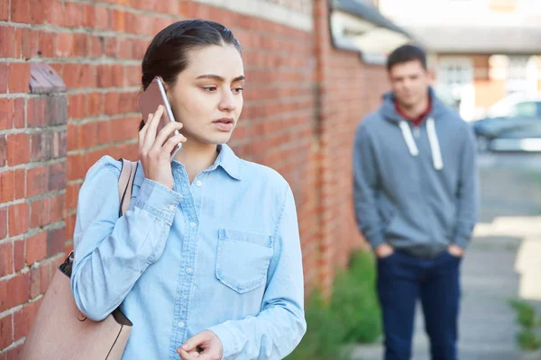 Woman Calling Help Mobile Phone Whilst Being Stalked City Street — Stock Photo, Image