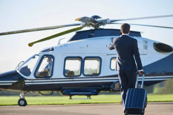 Rear View Businessman Walking Helicopter Whilst Talking Mobile Phone — Stock Photo, Image