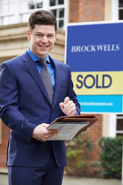 Portrait Of Male Realtor Standing Outside Residential Property — Stock Photo, Image