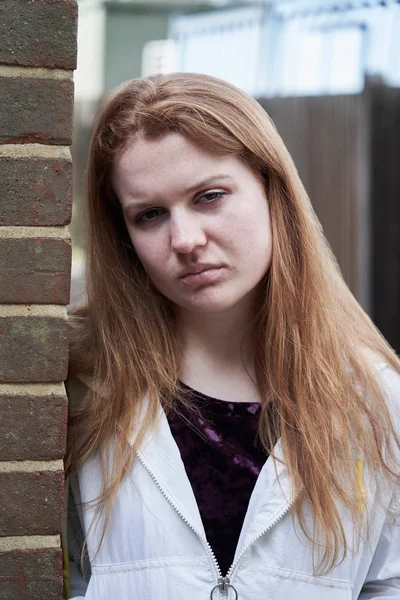 Portrait Of Serious Teenage Girl Leaning Against Wall In Urban S — Stock Photo, Image