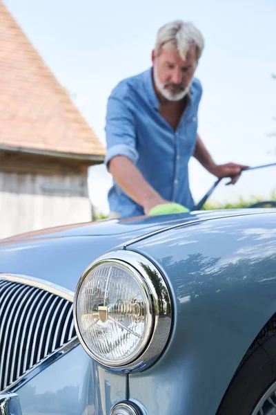 Mature Man Polishing Restored Classic Sports Car Outdoors At Hom — Stock Photo, Image