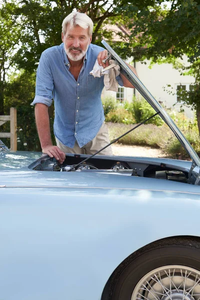 Portrait Of Mature Man Working On Engine Under Hood Of  Restored — Stock Photo, Image