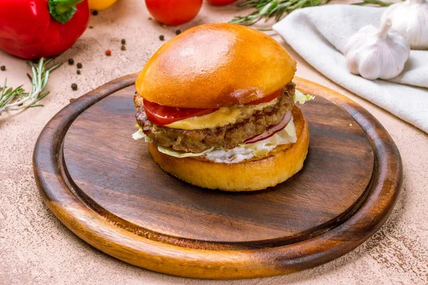 American Burger with meat on wooden plate