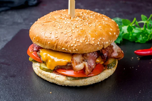 Burger with meat cheese and bacon
