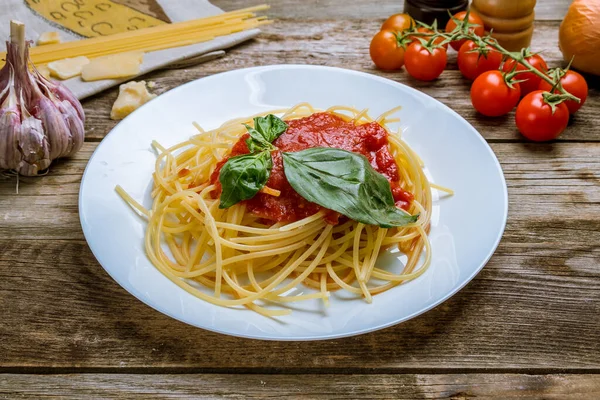 Spaghetti with vegetables in tomato sauce