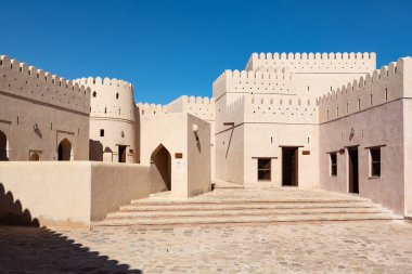 Patio of fort of Bani bu Hassan in Oman, with its typical beige clay color clipart