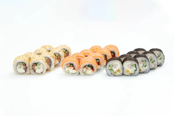 Sets of different sushi roles on a white background