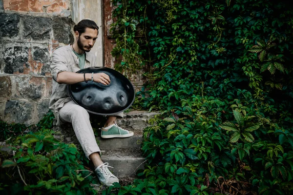 handpan in the hands of a musician. Music background for alternative contemporary music for meditation and relaxation