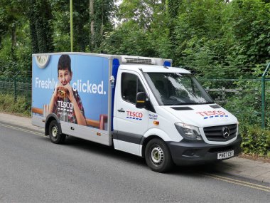 Tesco home delivery van supplying groceries during the Coronavirus (COVID-19) pandemic clipart