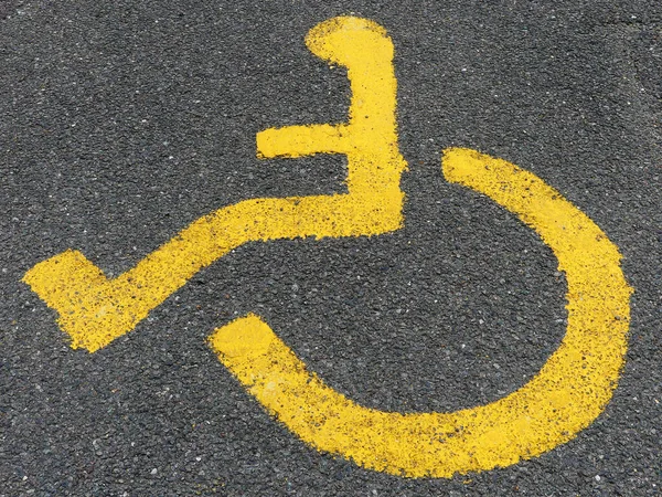 Yellow Painted Disabled Parking Sign Tarmac Surface — Stock Photo, Image