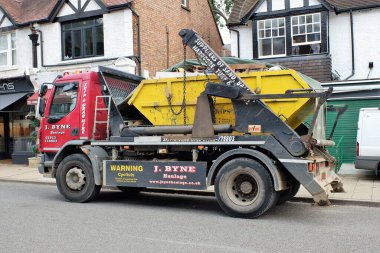 DAF skip loader truck belonging to J Byne Haulage Limited of Rickmansworth, Hertfordshire clipart