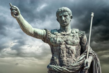 Rome, Italy, Bronze statue of Emperor Augustus on a stormy sky background. clipart