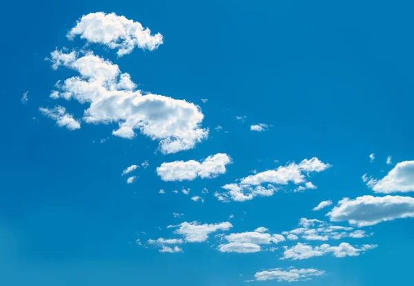 Clouds on a background of blue sky in clear weather