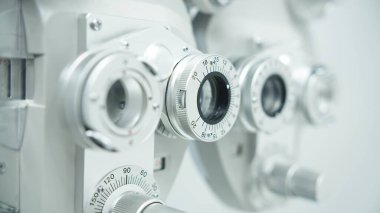 Autorefractor at optometrist clinic. shallow depth of field clipart