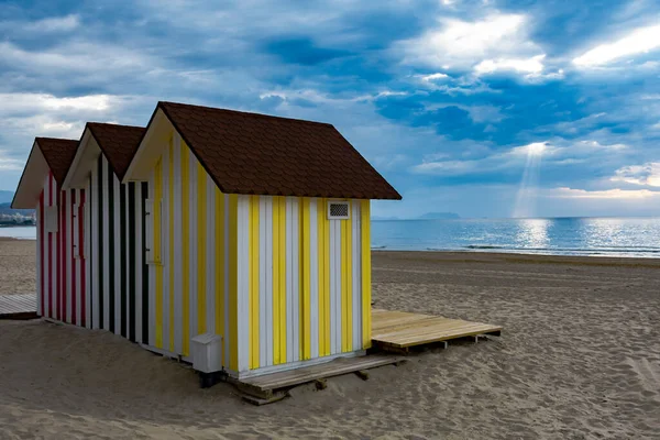 booths on beaches to change clothes on a cloudy day