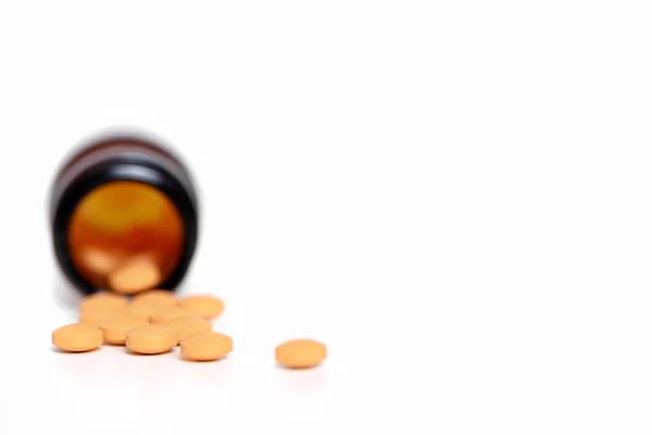 Pills spilling out of pill bottle — Stock Photo, Image