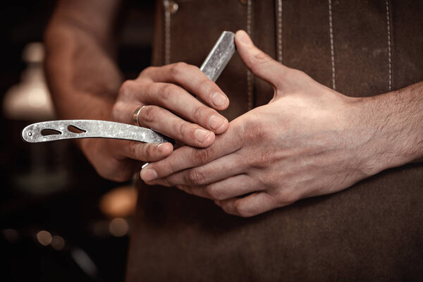 barber hand and blade