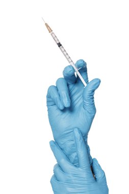 Mavi eldiven şırınga tutarak el