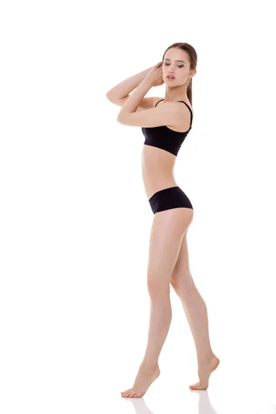 Kvinna med perfekt sportig kropp i svart underkläder — Stockfoto