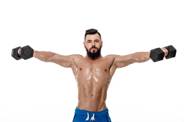 Hombre musculoso haciendo ejercicios con pesas . — Foto de Stock