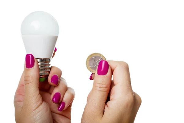 LED bulb and coins — Stock Photo, Image