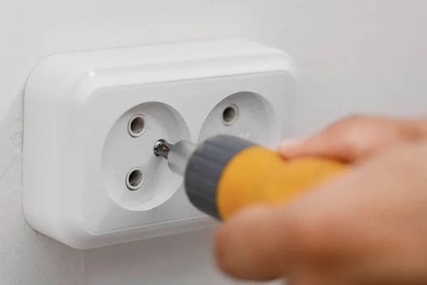 Electrician installing electrical socket — Stock Photo, Image