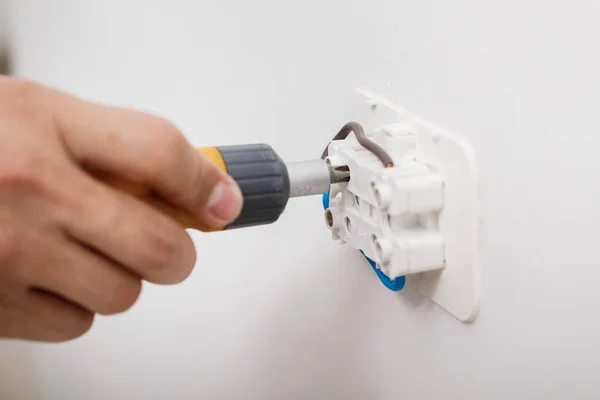 Electrician installing electrical socket — Stock Photo, Image