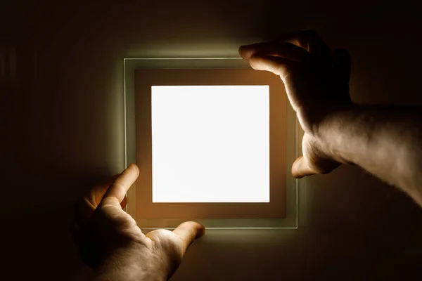 Electrician installs an LED light — Stock Photo, Image