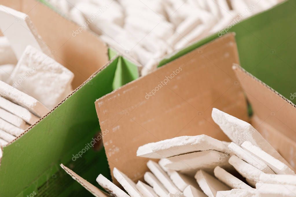 lot of white decorative bricks in a box