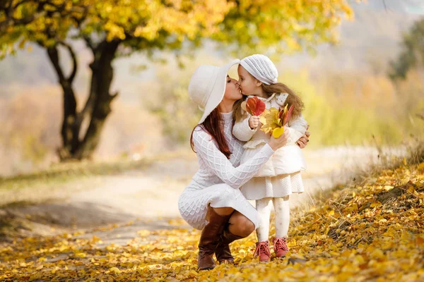 Charming beautiful mother walks with little daughter girl — Stock Photo, Image