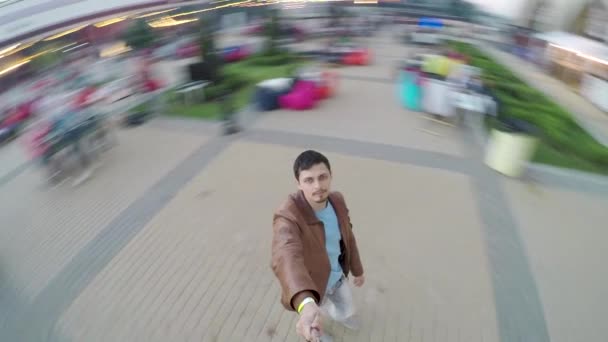 Portrait of happy caucasian man spinning around — Stock Video