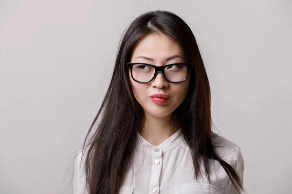 Smiling asian woman in glasses and white shirt — Stock Photo, Image