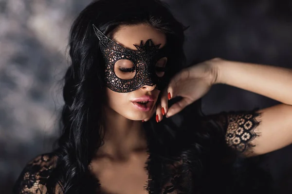 Portrait of sexy beautiful woman in lace lingerie and carnival mask — Stock Photo, Image